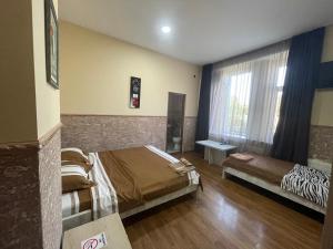 Voodi või voodid majutusasutuse Fazis Hotel toas