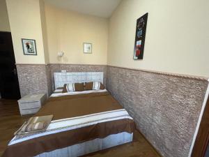 Voodi või voodid majutusasutuse Fazis Hotel toas