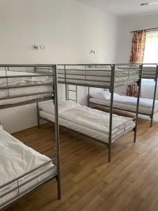 
a bedroom with two bunk beds and a window at Hostel Little Quarter in Prague
