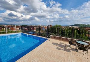 a swimming pool on the roof of a building at Sky apartmani & spa-Vip Lux DOO in Leskovac