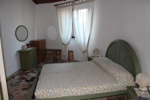 Cama ou camas em um quarto em Ville Alba & Azzurra