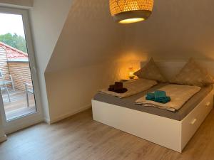 Katil atau katil-katil dalam bilik di Wohnen am Südstrand - Ferienwohnung 2 4