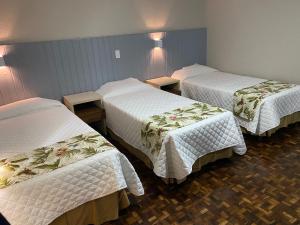 Postel nebo postele na pokoji v ubytování Hotel Pax