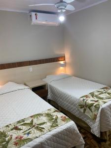 Postel nebo postele na pokoji v ubytování Hotel Pax