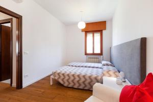 Łóżko lub łóżka w pokoju w obiekcie Venice Lido Wonderful Apartment with Terrace
