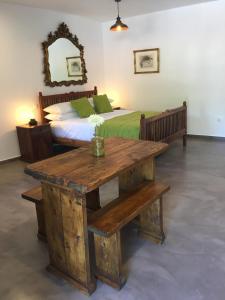 A bed or beds in a room at Pebbles of Kioni