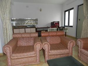 Posezení v ubytování Le Rhododendron Chambres D'hotes