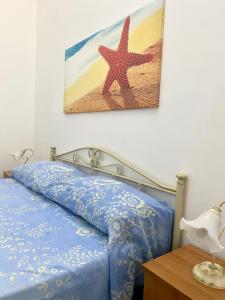 En eller flere senge i et værelse på Baia Salentorelax San Gregorio