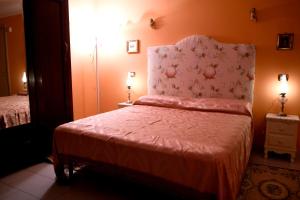A bed or beds in a room at La Casa Della Volpe