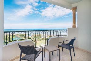 a balcony with chairs and a view of the ocean at Iberostar Selection Royal El Mansour in Mahdia