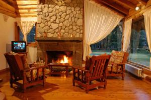 TV a/nebo společenská místnost v ubytování Cabañas Ruca Kuyen Golf & Resort