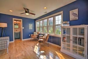 a living room with blue walls and a table and chairs at Cape May Quad with Grill - 7 Blocks to Beach! in Cape May