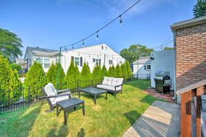 a backyard with two chairs and a grill at Cape May Quad with Grill - 7 Blocks to Beach! in Cape May