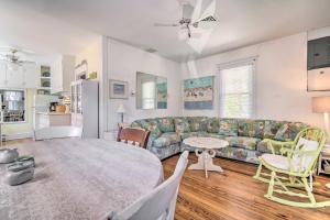 a living room with a couch and a table at Darling Ocean City Cottage, 2 Blocks to Beach! in Ocean City