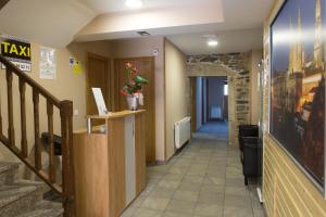 a hallway with a staircase and a stair case at Albergue San Anton in Melide