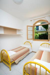 Tempat tidur dalam kamar di Villaggio Teodorico