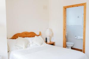 Postelja oz. postelje v sobi nastanitve Glenhill B&B
