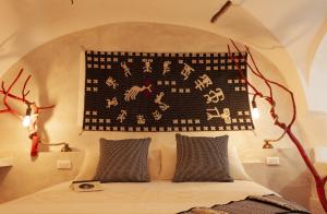 Кровать или кровати в номере Hotel Anticos Palathos