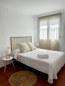 Posteľ alebo postele v izbe v ubytovaní Apartamentos - Alameda