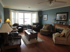 a living room filled with furniture and a fireplace at Lancaster Inn B&B in Bonavista