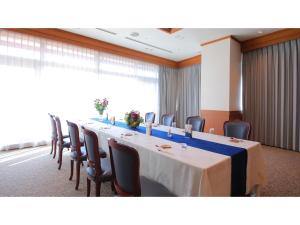 a conference room with a long table and chairs at Ise Pearl Pier Hotel - Vacation STAY 60823v in Ise