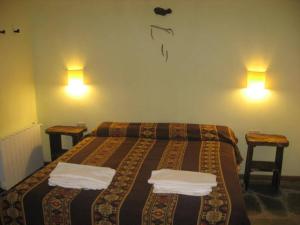 Ein Bett oder Betten in einem Zimmer der Unterkunft Hosteria del Sauquen
