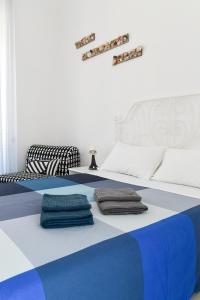 Кровать или кровати в номере "DueEmme Lodge" , a pochi passi dal porto