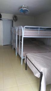 
A bunk bed or bunk beds in a room at Sana El Jardin Secreto
