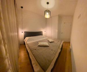 Postel nebo postele na pokoji v ubytování Apartman Dragica