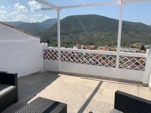 a balcony with a view of the mountains at San Francisco II in Siles