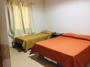 Cama ou camas em um quarto em Cabañas Las Malvinas