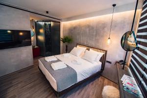 A bed or beds in a room at Project 3 Urban Chic Hotel