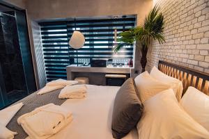 A bed or beds in a room at Project 3 Urban Chic Hotel