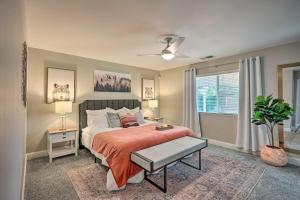 a bedroom with a large bed and a window at Family-Friendly Home, 6 Mi to Riverwalk Plaza in Bakersfield