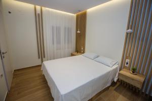 a bedroom with a large white bed in a room at Marianthe Apartments Ap2 in Ioannina