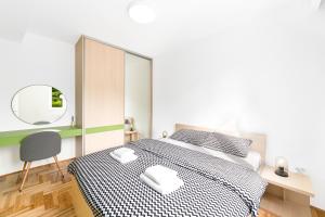 Posteľ alebo postele v izbe v ubytovaní Djokic Apartments