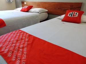 Llit o llits en una habitació de Hotel Líder - By UP Hotel