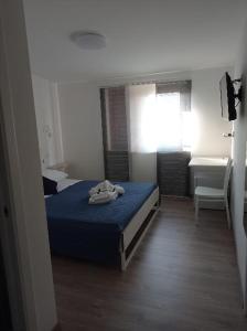 Łóżko lub łóżka w pokoju w obiekcie Bouganville da Giò