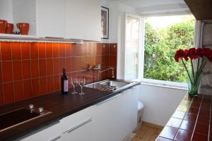 a kitchen with a sink and a window at Apartment Naval in Dubrovnik