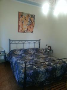 A bed or beds in a room at Pietra Preziosa Bed & Breakfast