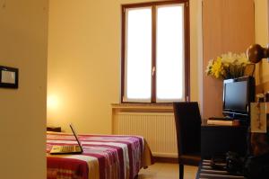 Letto o letti in una camera di Albergo Visconti