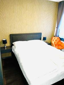 Postel nebo postele na pokoji v ubytování DUA Hotel