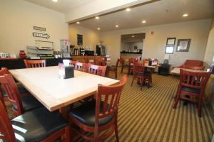 a dining room with a table and chairs at Bowman Inn and Suites in Bowman