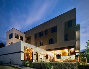 a large building with lights in front of it at Hotel Dryce in Fort Worth