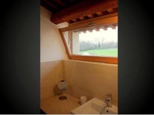 a bathroom with a sink and a window at Homely Farmhouse in Pagnano Italy near Forest in Asolo