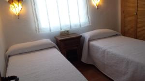 Postel nebo postele na pokoji v ubytování Casas Isabel