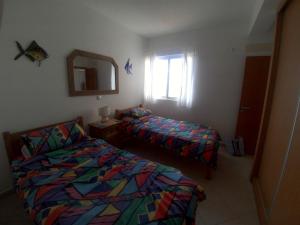 A bed or beds in a room at Vista Oceano - Boa Vista Island