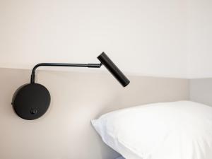 Una cama o camas en una habitación de Hotel AT HOME - late arrival self check in