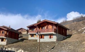 a house on the side of a hill at Chalet C4 Les Marmottes in Valmeinier