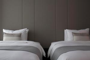 Lova arba lovos apgyvendinimo įstaigoje Manho Hotel